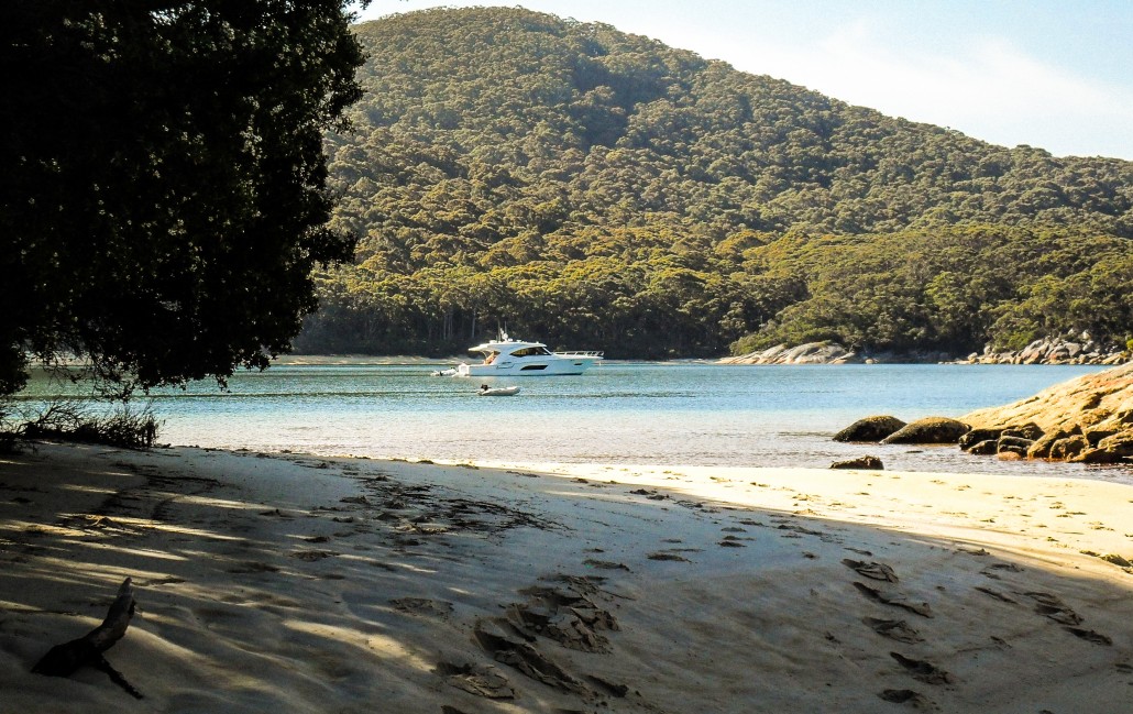 Footprints in the sand. Ray Haddrell's Riviera 565 SUV Rayzaway in Refuge Cove